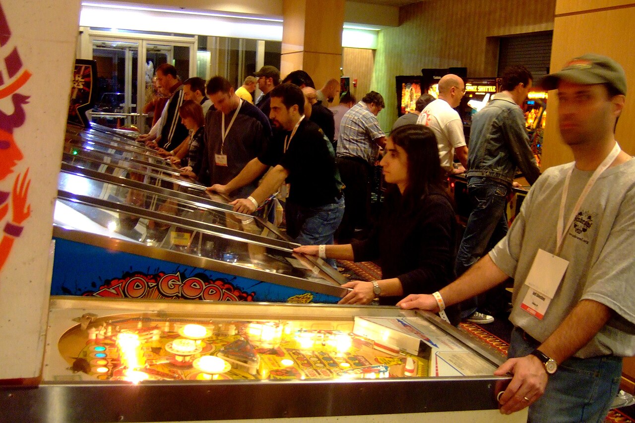 Players in a pinball exhibition hall.