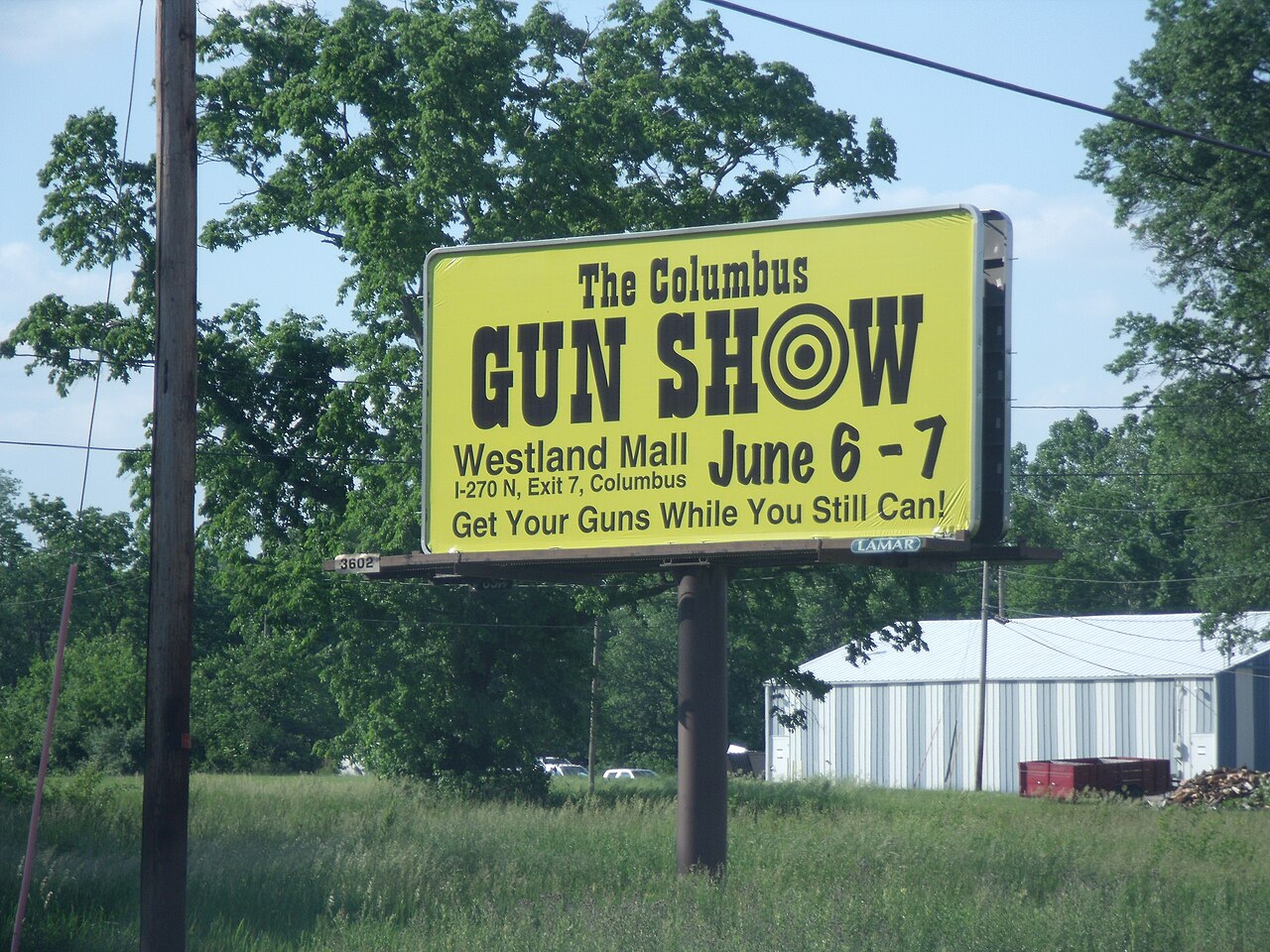 An archival Columbus, Ohio, gun-show billboard.