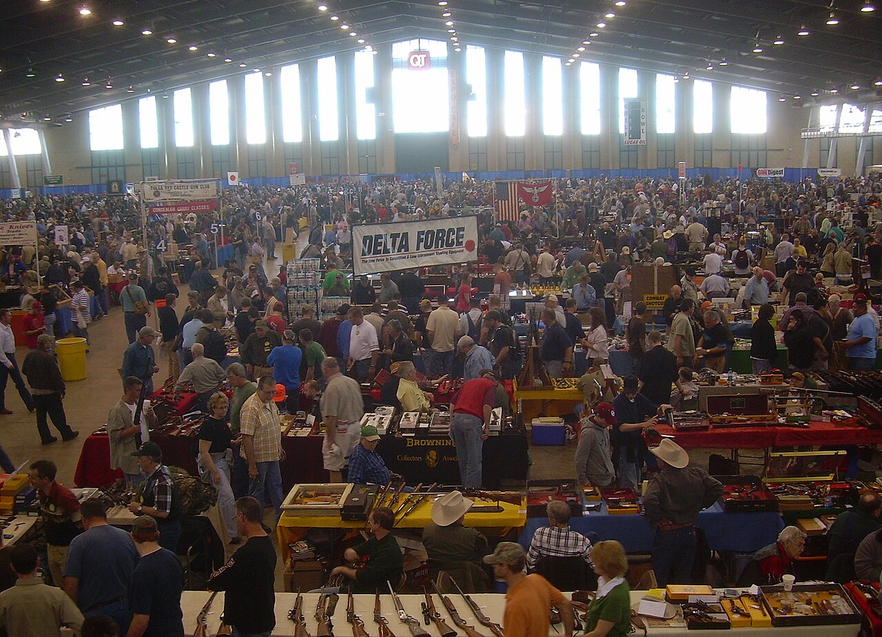 Visitors and display tables at a Wanenmacher show in Tulsa.