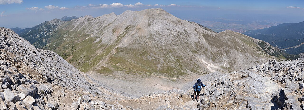 Hikers on a mountain trail in the Pirin range.